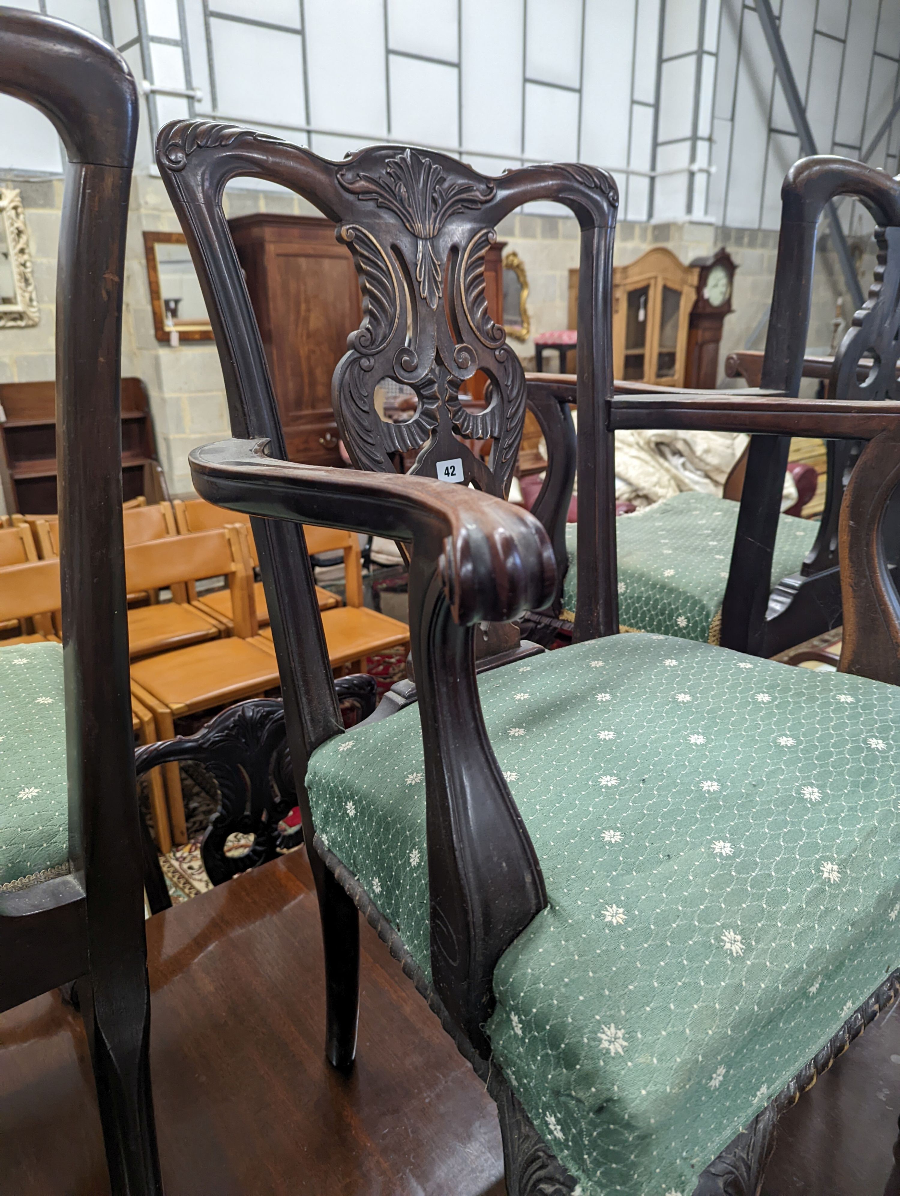 A set of twelve early 20th century Chippendale revival carved mahogany dining chairs including two carvers, width 56cm, height 95cm